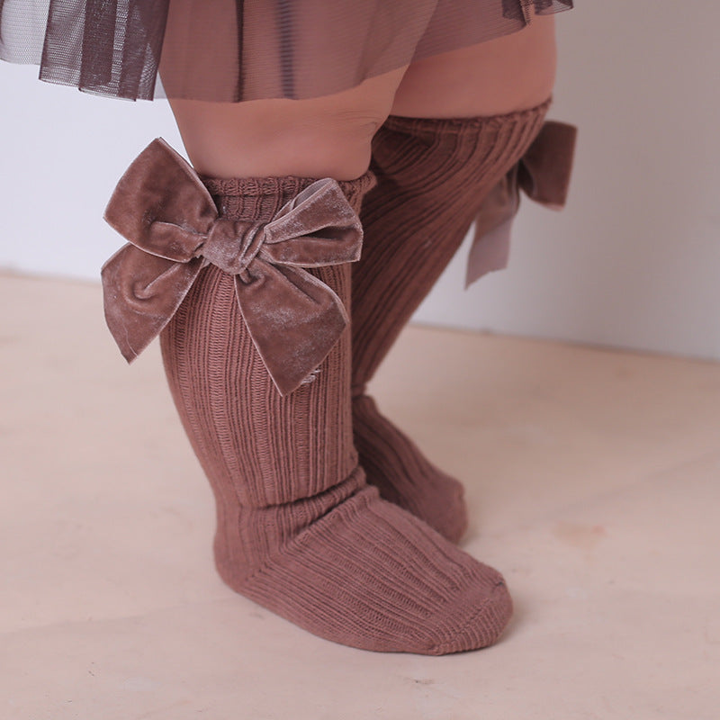 Oluuu. Baby Wollsocken mit Schleifen-Design