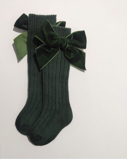 Oluuu. Baby Wollsocken mit Schleifen-Design